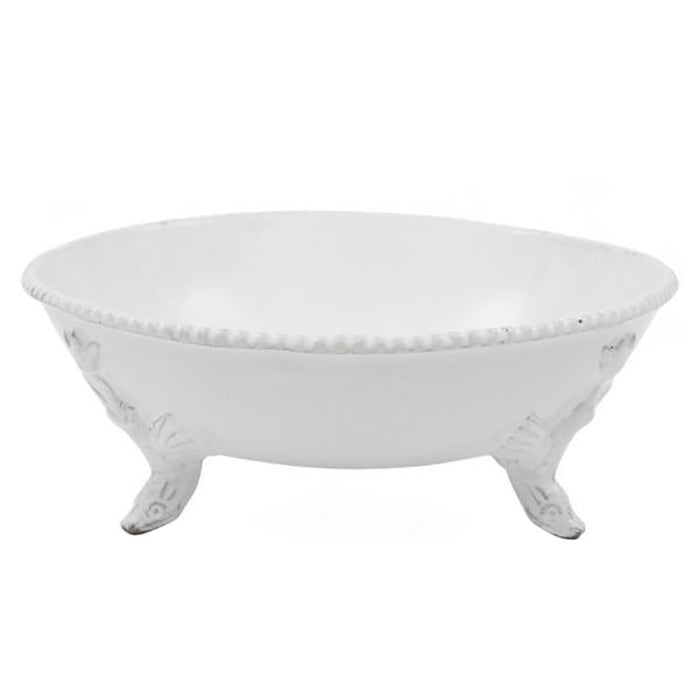 Round ceramic bowl with decorative feet in a milky white glaze.
