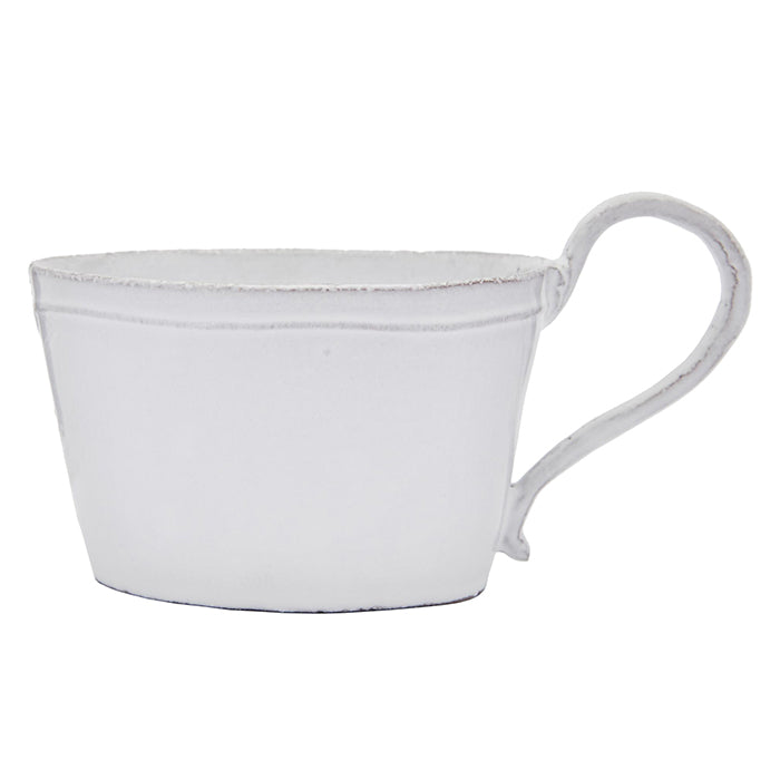 Short ceramic mug in a milky white glaze.