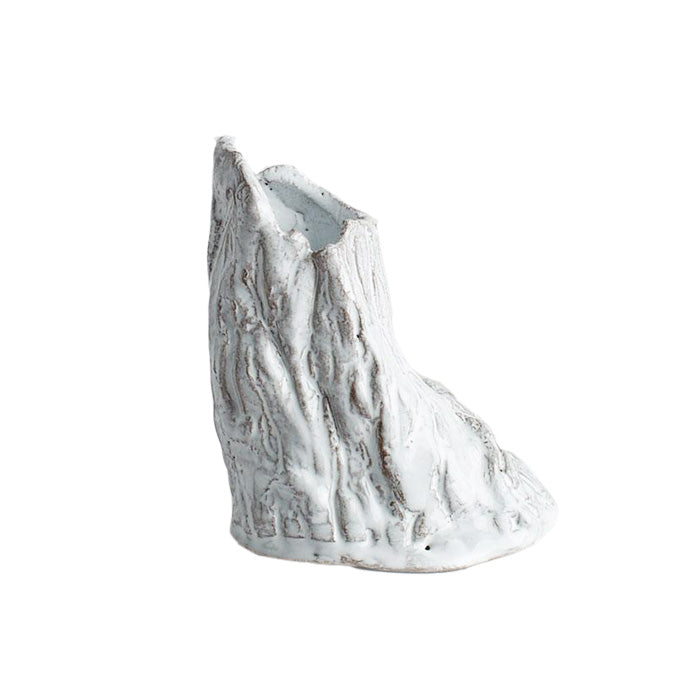 Tree trunk shaped vase with two openings in a white glaze.