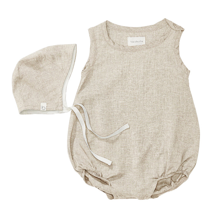 Matching cream newborn outfit with a bonnet and sleeveless romper with no legs.