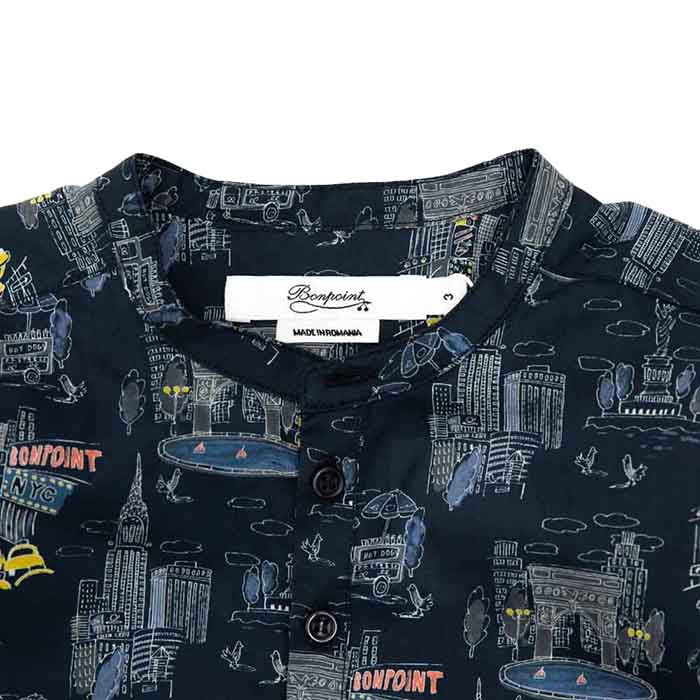 Close up of the round neckline and New York city illustrated print.