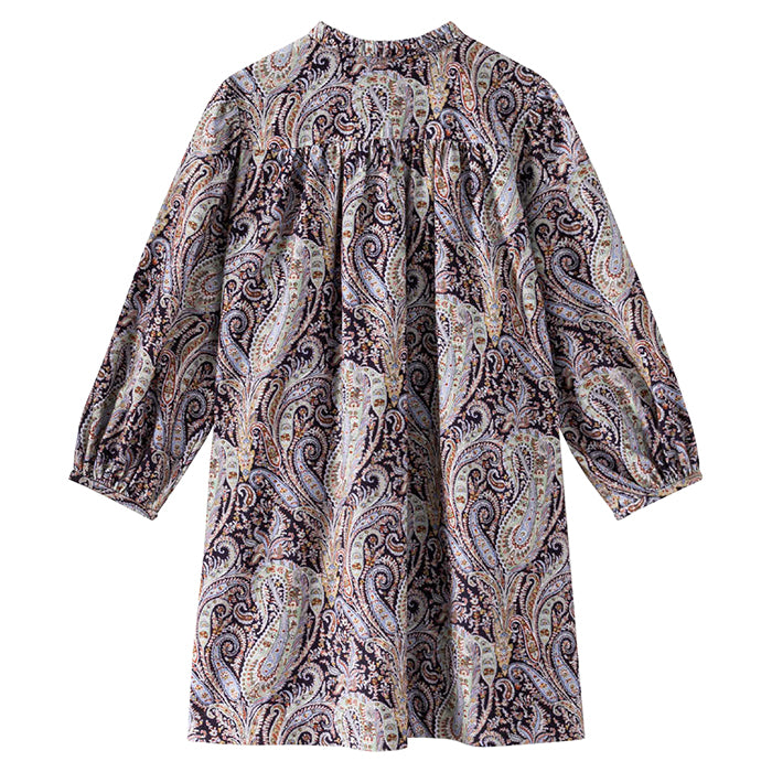 Long sleeved dress in a purple paisley print from the back.