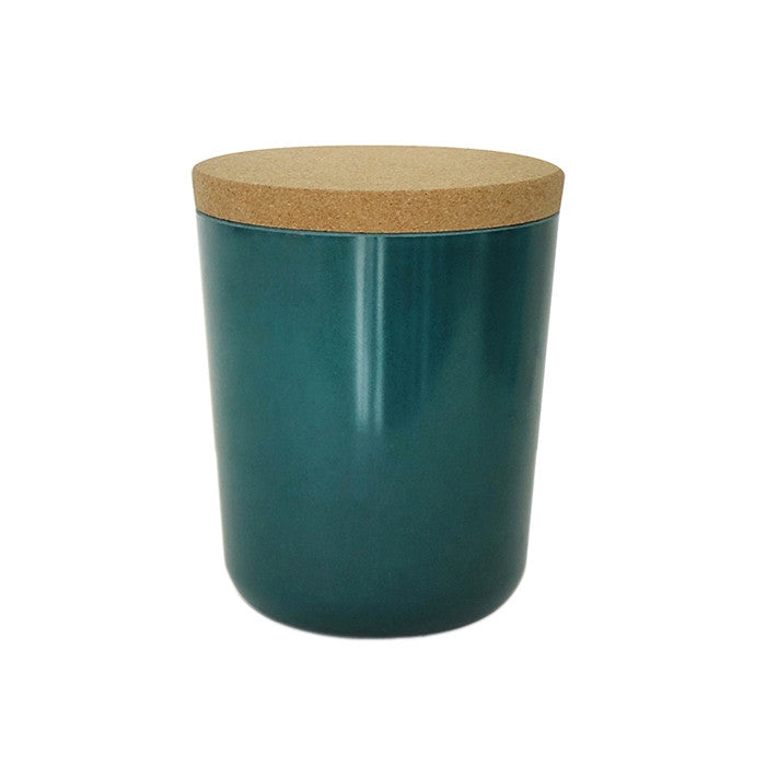 Green blue jar with a cork lid.