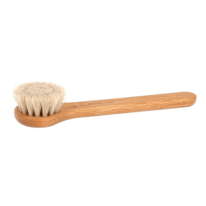 Wooden face brush with soft horsehair bristles.
