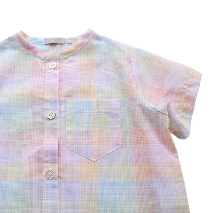 Close up of the button closure and patch pocket on the chest.