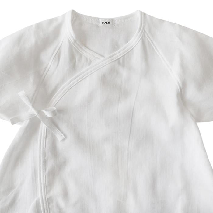 Close up of the neckline of the wrap romper.