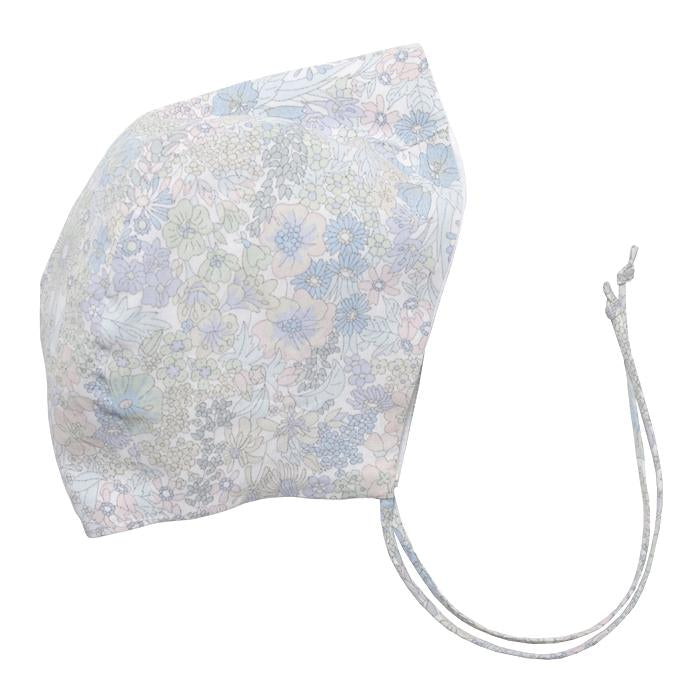 Cotton baby bonnet with ties under the chin and an all over pale green and blue floral print.