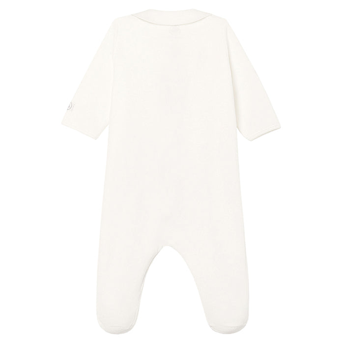 Long sleeved white pyjamas with attached feet from the back.