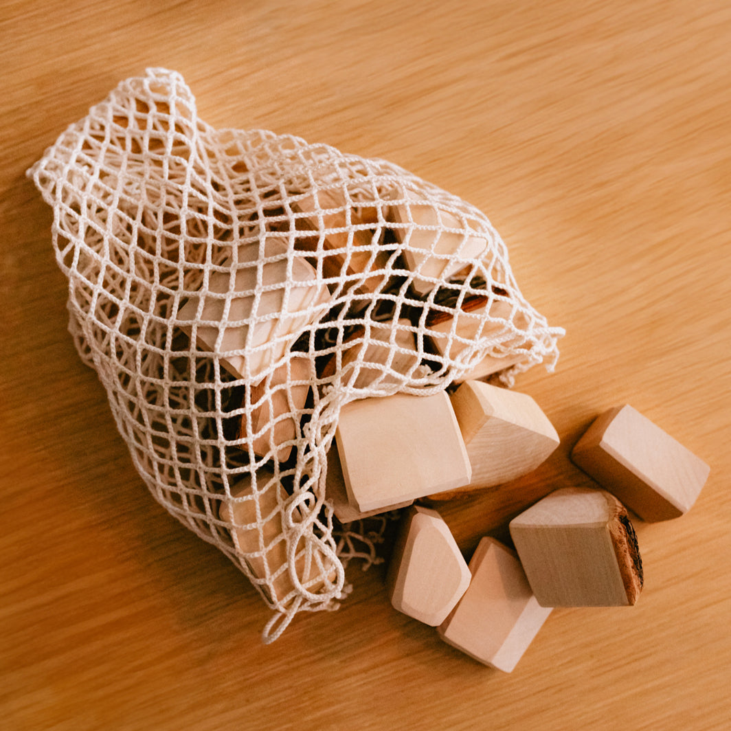 Grimm's Set Of 15 Wooden Blocks With Bark In Net Bag