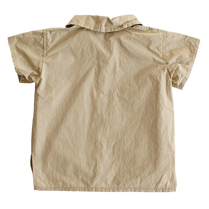 Short sleeved button up shirt with a collar in gold yellow from the back.