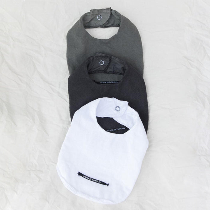 Three monochrome baby bibs.