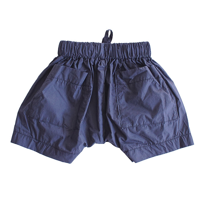 Pull on harem shorts in blue with large patch pockets from the back.