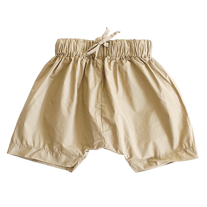 Pull on harem shorts in yellow gold.
