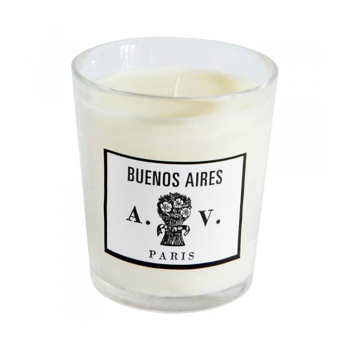 Candle in a hand-blown glass container with a vintage black and white label.