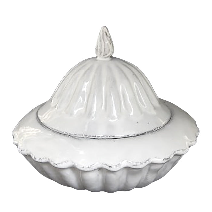 Ceramic candy bowl with a lid and scalloped edges in a milky white glaze.