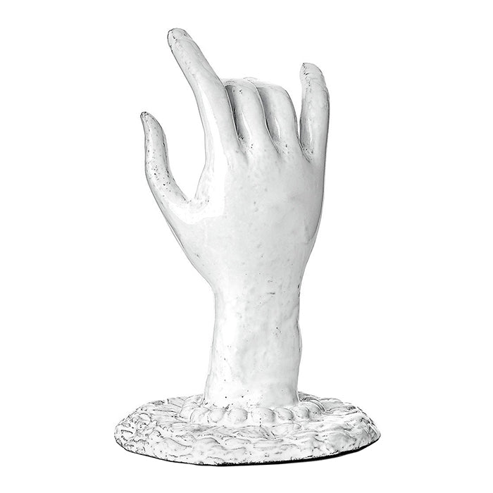 Decorative ceramic hand shaped ornament with a base in a milky white glaze from the back.