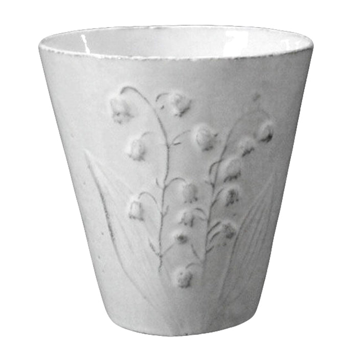 Ceramic vase with a floral design in a milky white glaze.