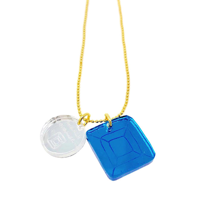 Brass chain necklace with a blue and silver acrylic charms.