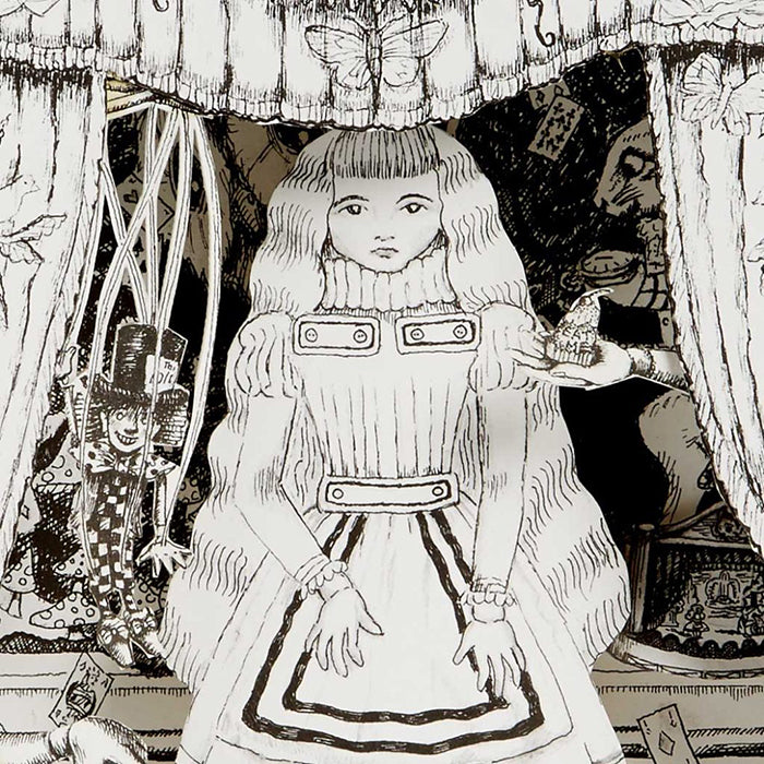 Close up of the illustrated Alice In Wonderland themed black and white paper diorama.