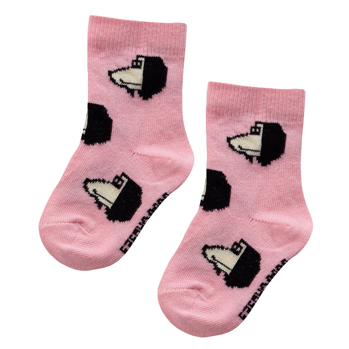 Pink socks with a knit black and cream dog head pattern.
