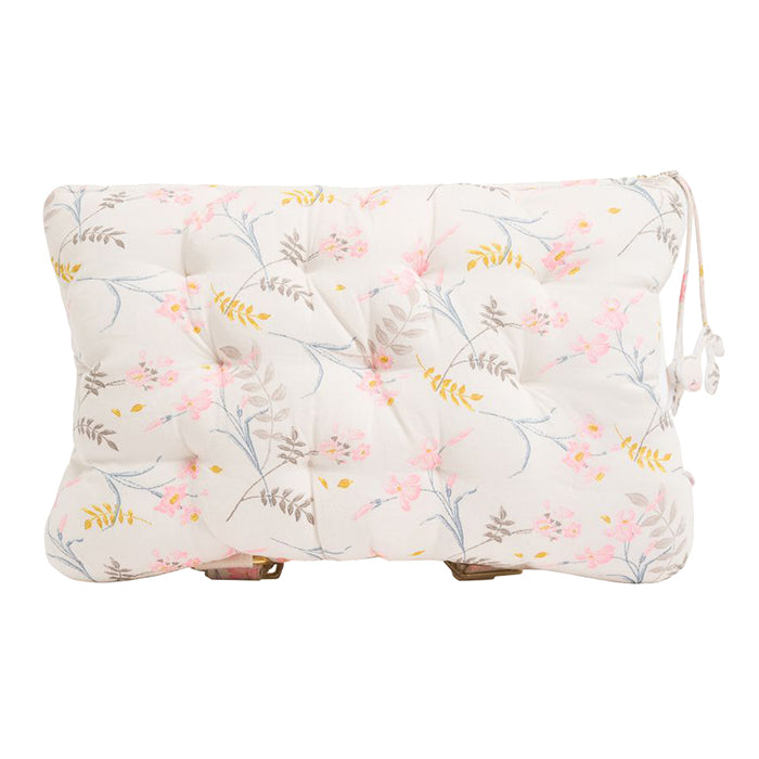 Pillow shaped backpack in cream with an all over pink and brown floral print from the front.