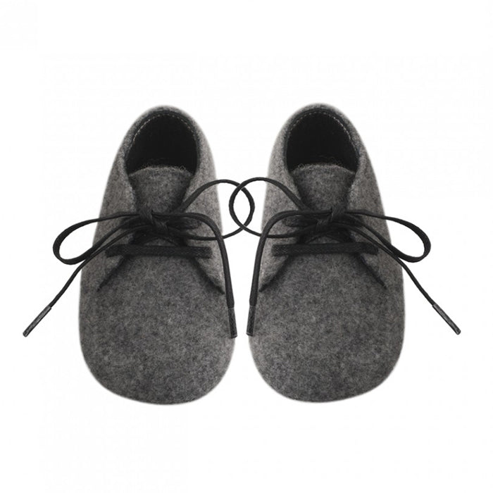 A pair of dark grey felt lace up boots from the front.