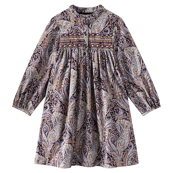 Long sleeved dress with smocking across the chest in a purple paisley print.
