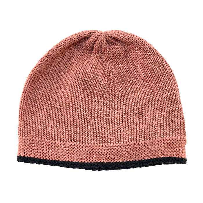 Pink knit beanie with a black trim.