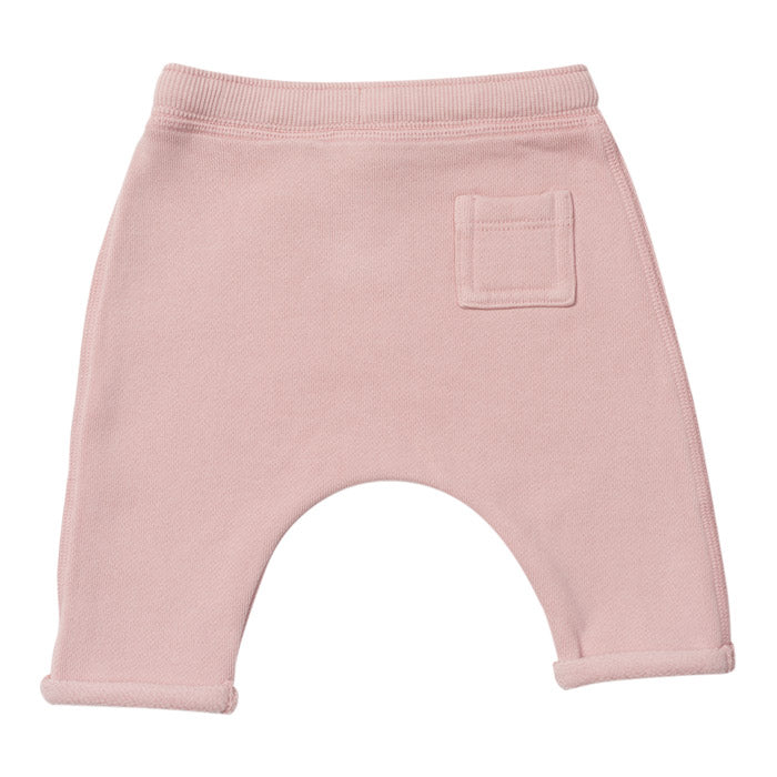 Pink harem sweatpants with a patch pocket on the back.