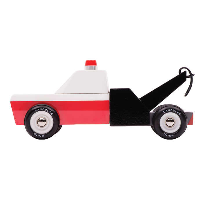Red, white and black wooden toy tow truck.