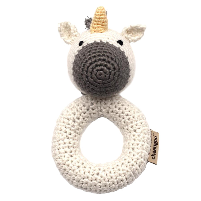 White crochet ring rattle with a unicorn head.