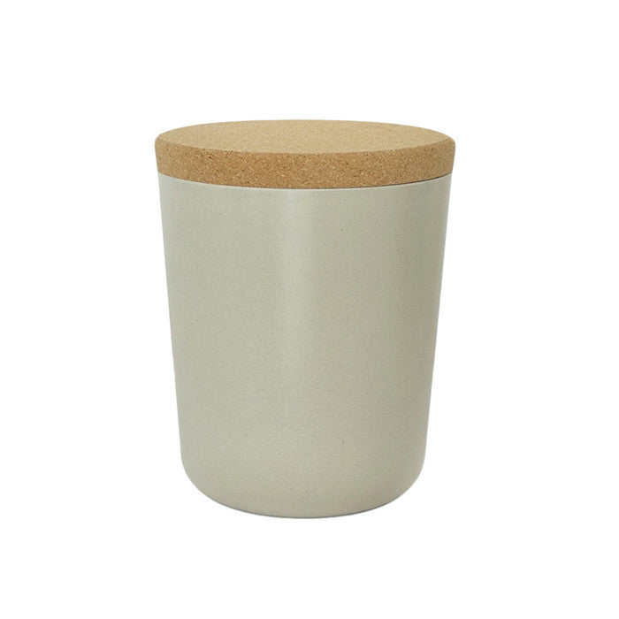 Beige grey jar with a cork lid.