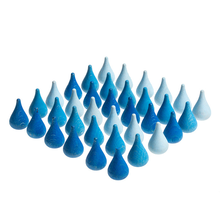 Wooden mini raindrop shaped pieces in various shades of blue.