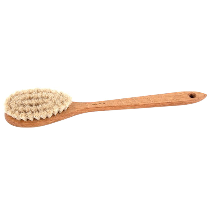 Wooden bath brush with a long handle and horsehair bristles.