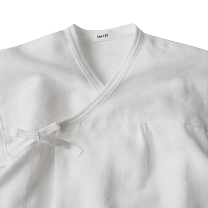 Close up of the wrap neckline and tie closure.