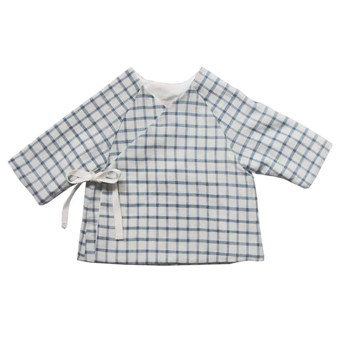 Long sleeved wrap jacket in a white with blue check print.