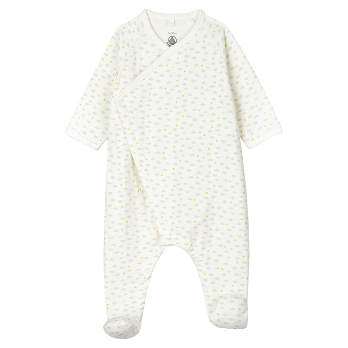Long sleeved pyjamas with wrap closure and attached feet in white with an all over grey cloud and yellow star print.