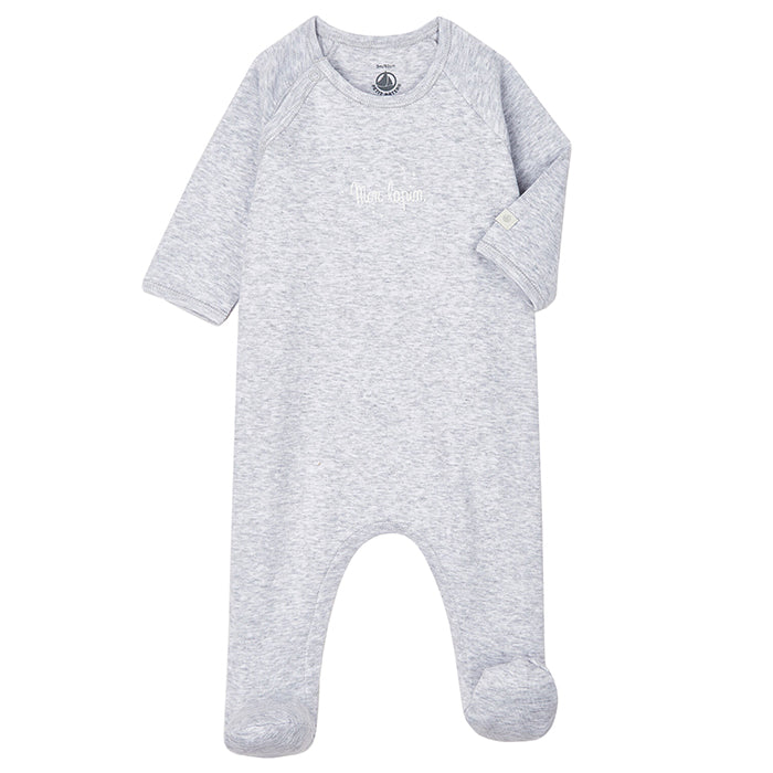 Grey long sleeved baby pyjama with snaps down the side and attached feet.