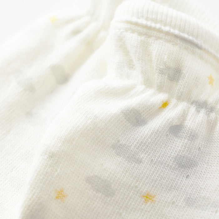 Close up of the jersey fabric and grey cloud and yellow star print.