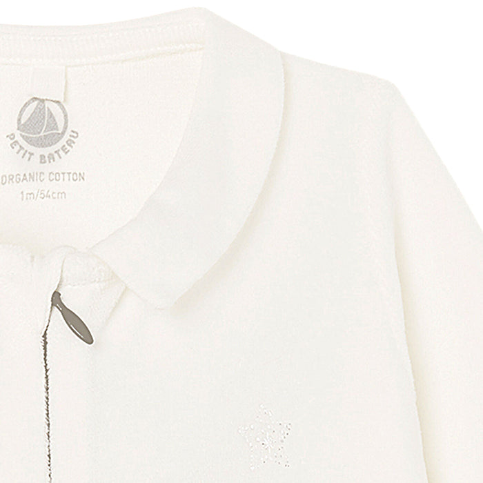 Close up of the peter pan collar and zip closure down the front.