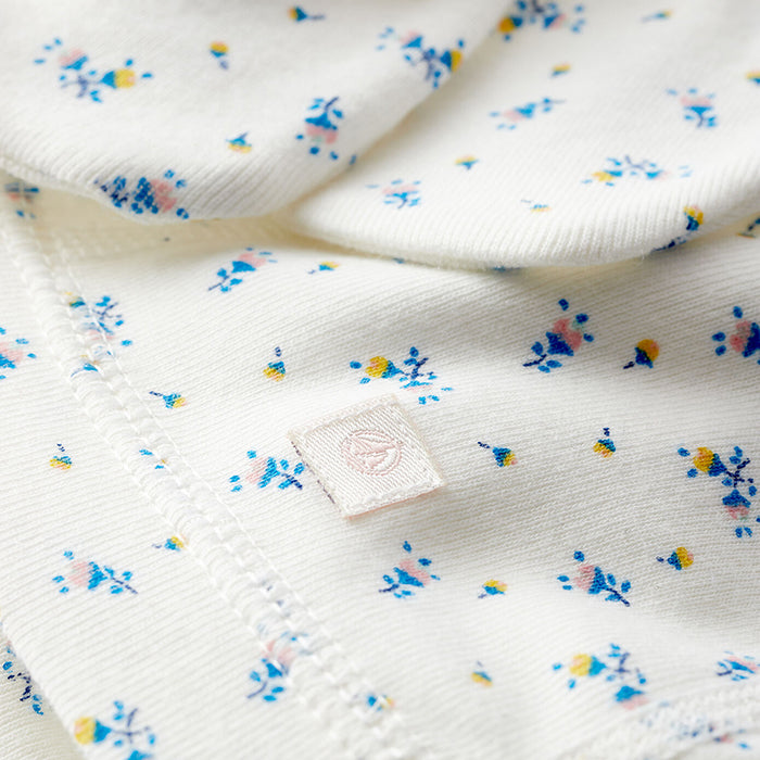 Close up of the cream jersey fabric with blue floral print.