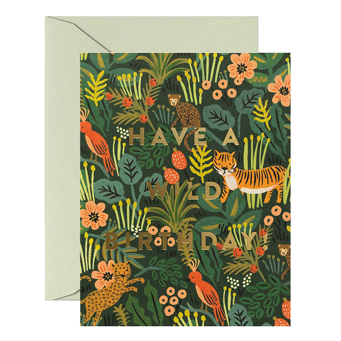 A birthday card with a green jungle pattern and envelope.
