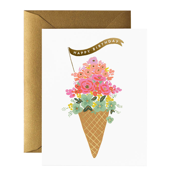 A birthday card with a pink floral ice cream cone print over a gold envelope.