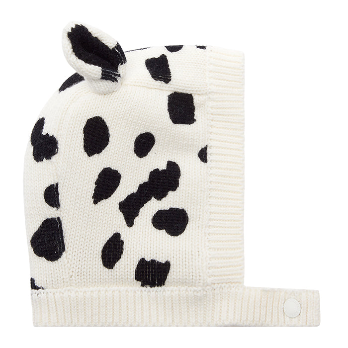 Baby hat with black spots and dog ears.