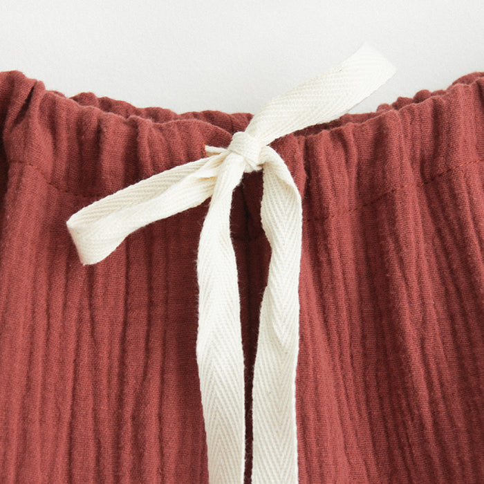 Close up of the waistband and cream drawstring.
